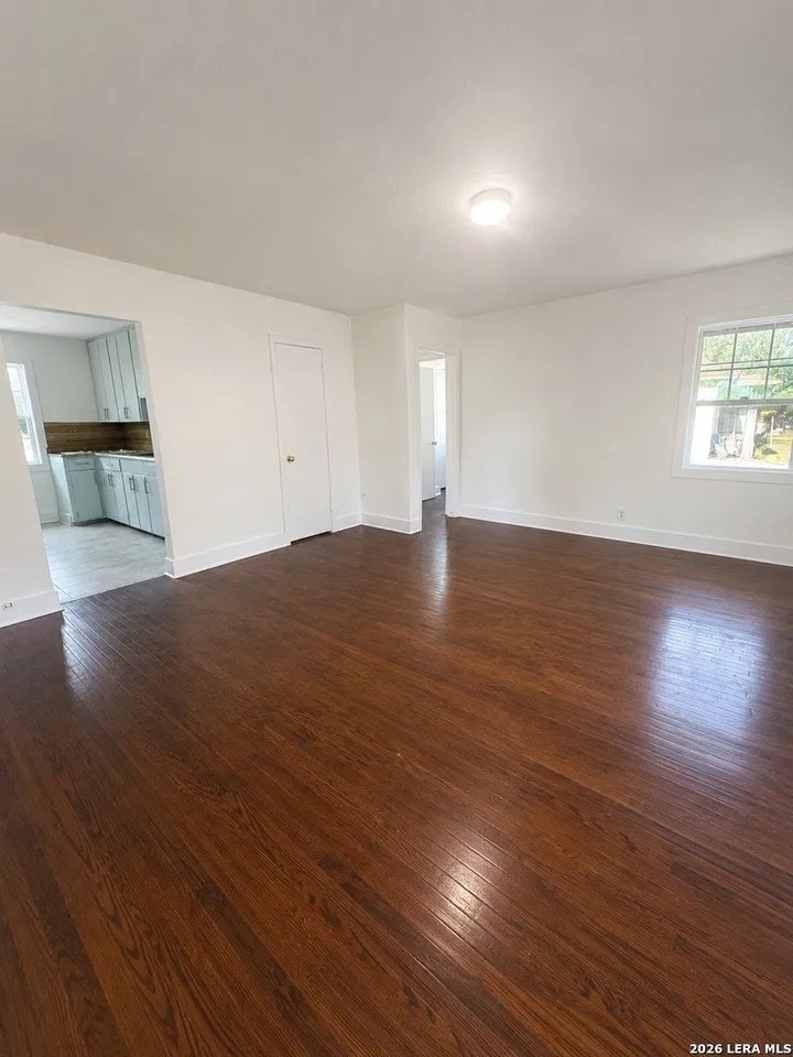 Living room — second angle showing wood floors and natural light