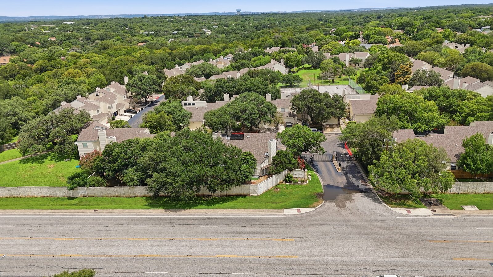 Wide aerial view of the Echo Creek community and surrounding rooftops