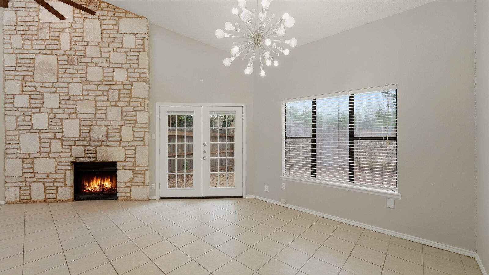 Kitchen with granite counters, subway-tile backsplash, and stainless range