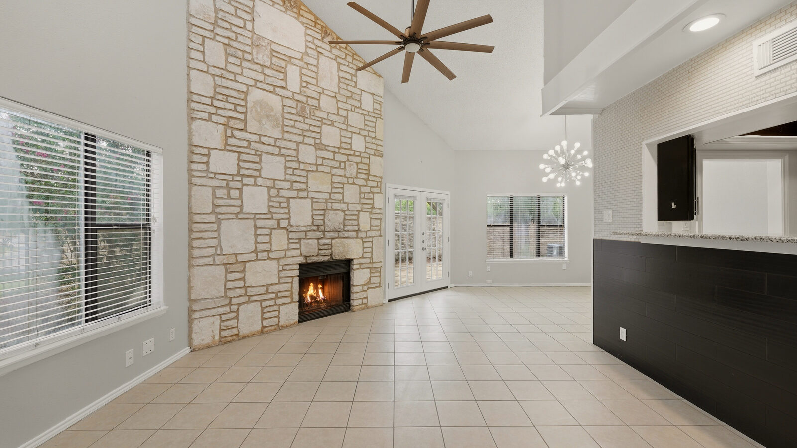 Kitchen with stainless refrigerator, microwave, and view toward the staircase
